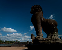 Stone Lions overlooking the bridge of the Western approach to Angkor Wat